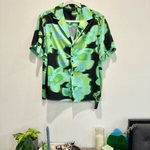 Cropped green and black printed button-up shirt
